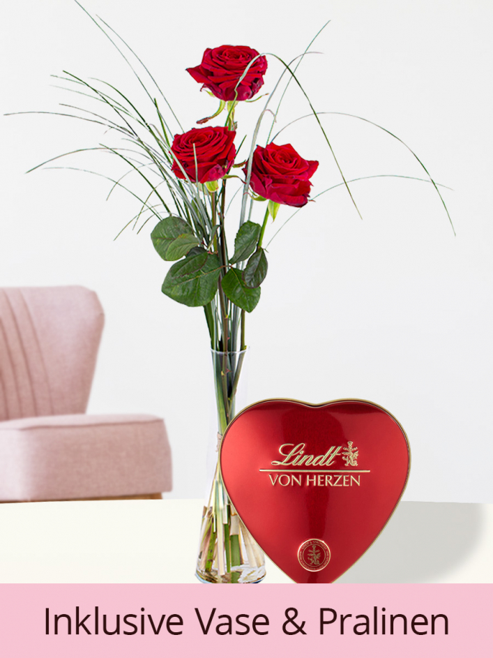 Drei Rote Rosen inklusive Glasvase und Lindt Pralinen